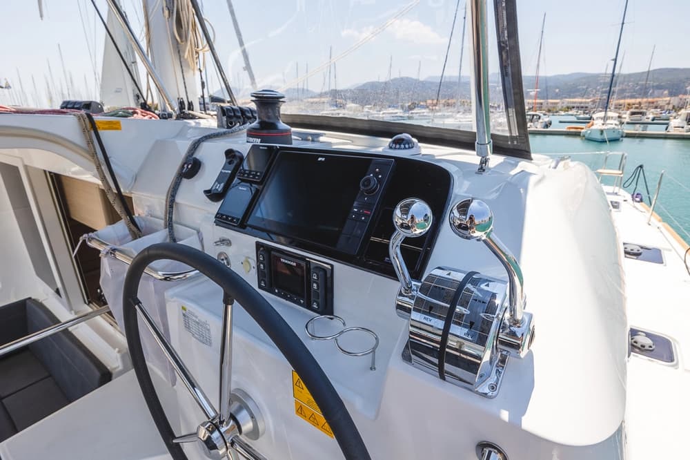 Lagoon 40 catamaran helm station with navigation instruments and dual engine controls – detailed Lagoon 40 review for yacht charter and sailing holidays.