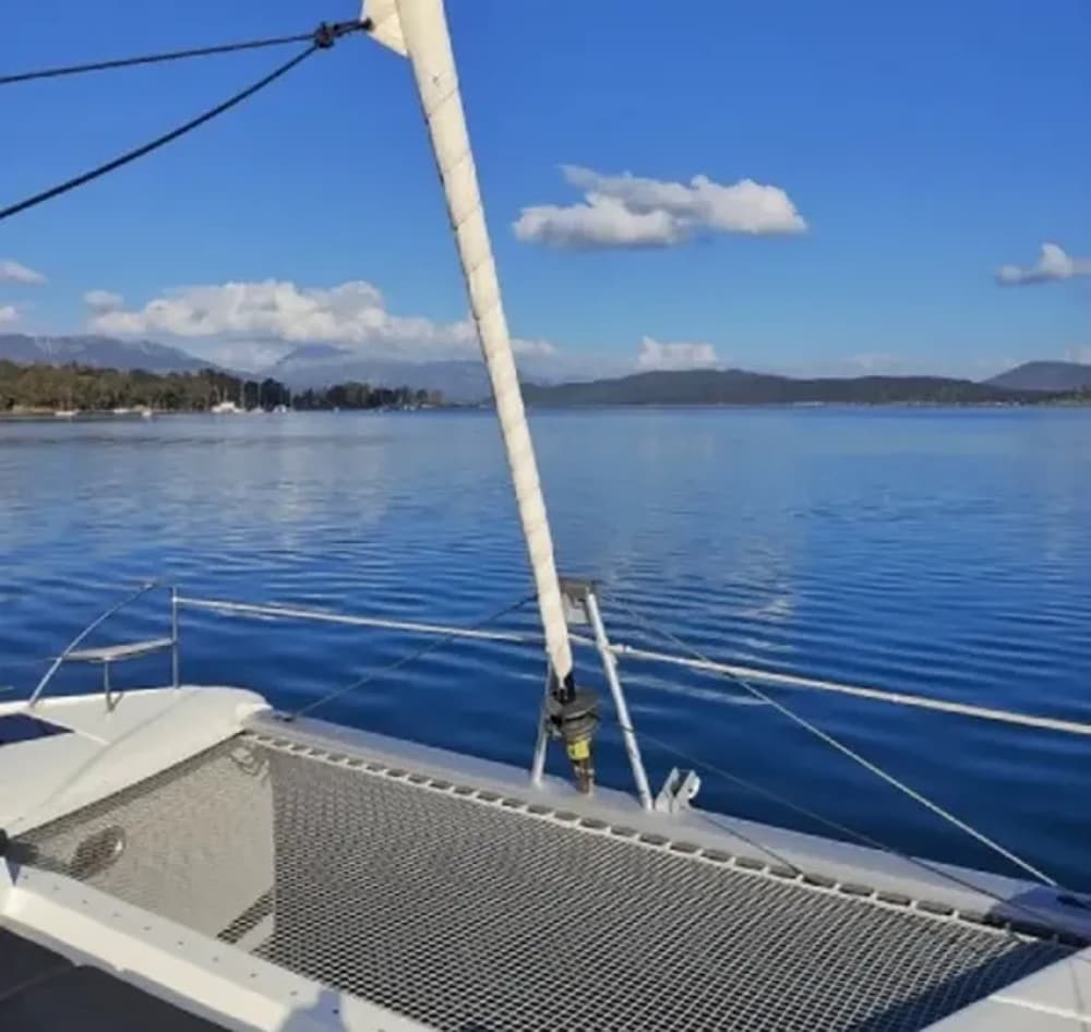 Stunning sailboat view on calm blue waters near Athens, perfect for a group sailing holiday.