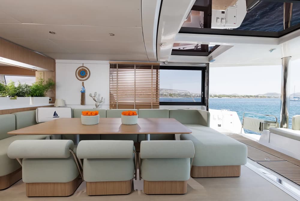 Contemporary salon dining area with panoramic ocean views on Bali 5.8 catamaran