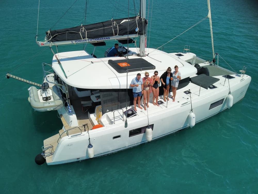 group of friends during a family holiday on board a sailing catamaran