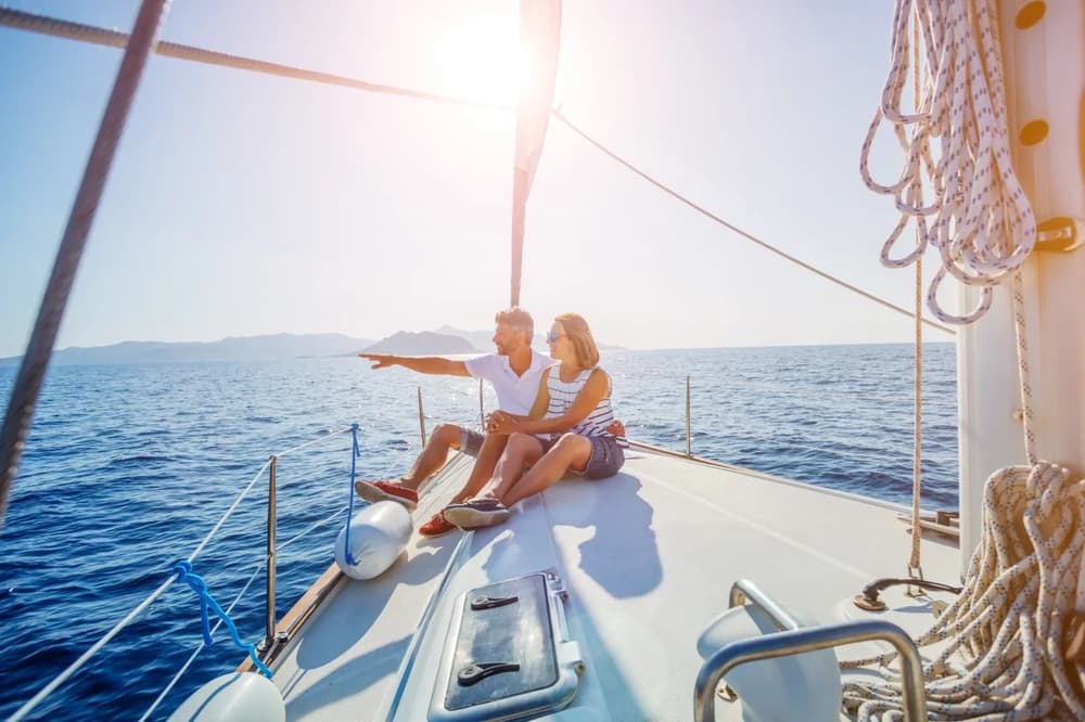 A couple on board a sailing yacht enjoying a nice morning in the Mediterranean