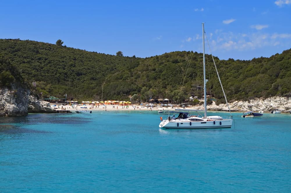 Clear turquoise waters, hilly coastline