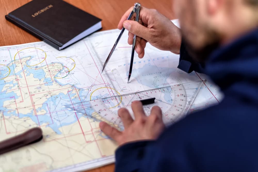 nautical maps being used by a captain on a skippered yacht charter on a sailing yacht