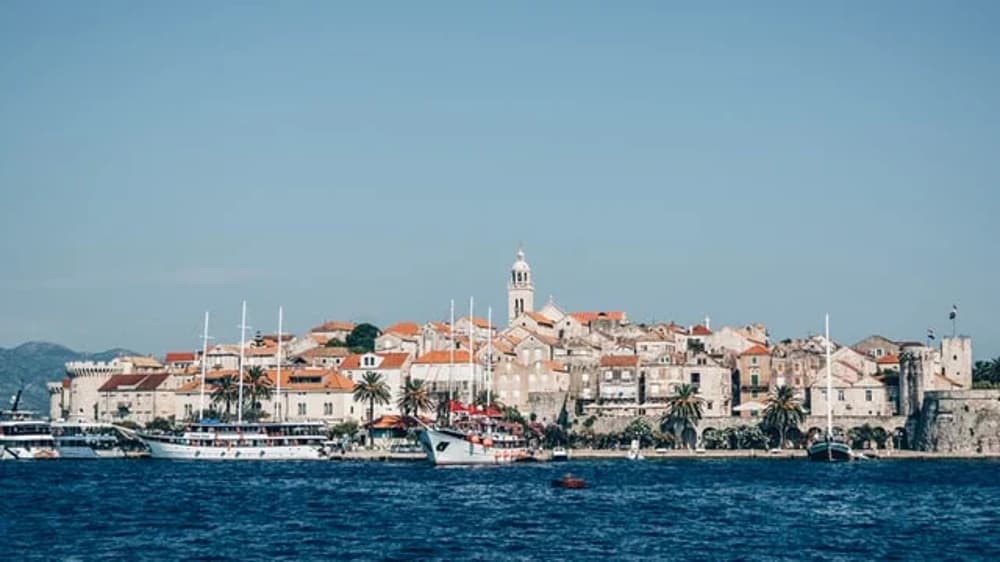 Korčula Island’s historic town viewed from the water, a highlight of a Croatia sailing holiday with its medieval charm and vibrant marina.