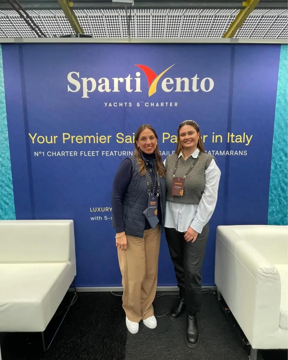 Yacht charter brokers at Spartivento stand, showcasing professional sailing consultancy and Mediterranean charter services at an international boat show.