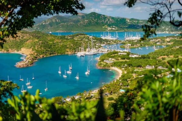 Aerial view of English Harbour in Antigua, a top celebrity sailing destination known for luxury yachts and stunning Caribbean scenery.